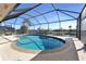 Enclosed pool featuring lovely canal views at 944 Genoa Ct, Punta Gorda, FL 33950