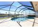 Enclosed pool providing a private oasis for relaxation and recreation with clear blue sky in the background at 944 Genoa Ct, Punta Gorda, FL 33950