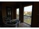 Cozy balcony setup with comfortable seating, offering nice community views at 99 Vivante Blvd # 404, Punta Gorda, FL 33950