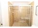 Bathroom showcasing a glass enclosed shower with tile and dual sliding glass doors at 99 Vivante Blvd # 404, Punta Gorda, FL 33950
