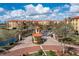 Well-maintained community entrance featuring a gatehouse and tropical landscaping at 99 Vivante Blvd # 404, Punta Gorda, FL 33950