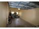 Spacious garage with concrete floors, storage shelves, a bicycle, and natural light at 99 Vivante Blvd # 404, Punta Gorda, FL 33950