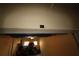 Garage entrance with unit number and storage with unfinished concrete floor at 99 Vivante Blvd # 404, Punta Gorda, FL 33950