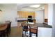 Well-lit kitchen featuring wood cabinetry, a peninsula with seating, and modern black appliances at 99 Vivante Blvd # 404, Punta Gorda, FL 33950