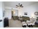 Comfortable living room featuring a ceiling fan, neutral paint, and lots of natural light at 99 Vivante Blvd # 404, Punta Gorda, FL 33950