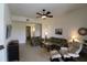Comfortable living room featuring a ceiling fan, neutral paint, and lots of natural light at 99 Vivante Blvd # 404, Punta Gorda, FL 33950