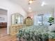 Bright bedroom with hardwood floors, large window, and stylish furnishings at 1027 Campbell St, Port Charlotte, FL 33953