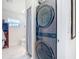 A modern laundry room, including washer and dryer, and featuring a bathroom area at 1027 Campbell St, Port Charlotte, FL 33953