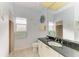 Cozy bathroom with a window, decorative starfish, and a shower at 1368 Grebe Dr, Punta Gorda, FL 33950