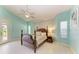 Bright bedroom features tile floors, ceiling fan, and backyard access at 1368 Grebe Dr, Punta Gorda, FL 33950
