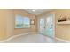 Bright bedroom with French doors that lead to a pool and patio area at 1368 Grebe Dr, Punta Gorda, FL 33950