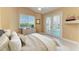 Comfortable bedroom with French doors to the pool and backyard at 1368 Grebe Dr, Punta Gorda, FL 33950