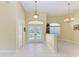 Bright foyer featuring tile flooring, chandelier lighting, and views of the front yard at 1368 Grebe Dr, Punta Gorda, FL 33950
