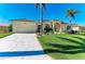 Attractive home with a spacious driveway and lush landscaping at 1368 Grebe Dr, Punta Gorda, FL 33950