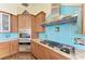 Updated kitchen features stainless appliances, granite countertops and tile backsplash at 1368 Grebe Dr, Punta Gorda, FL 33950
