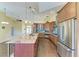 Stylish kitchen with stainless steel appliances, wooden cabinets, and a spacious island with bar seating at 1368 Grebe Dr, Punta Gorda, FL 33950