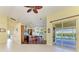 Spacious kitchen with wooden cabinets, an island bar and a view of the outdoor pool at 1368 Grebe Dr, Punta Gorda, FL 33950