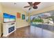 Inviting living room with fireplace and sliding glass doors to patio and pool area at 1368 Grebe Dr, Punta Gorda, FL 33950