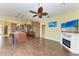 Open concept living room and kitchen area with hardwood floors and fireplace at 1368 Grebe Dr, Punta Gorda, FL 33950