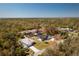 Aerial view showcasing the backyard, pool area, and surrounding greenery at 14195 Brisk Ave, Port Charlotte, FL 33953