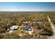 An aerial shot showcasing the home's location surrounded by lush greenery at 14195 Brisk Ave, Port Charlotte, FL 33953