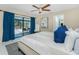 Comfortable bedroom with view of the screened patio and pool area at 14195 Brisk Ave, Port Charlotte, FL 33953