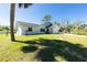 Charming home with a well-manicured lawn and beautiful landscaping at 14195 Brisk Ave, Port Charlotte, FL 33953