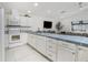 Bright kitchen with an island, stainless appliances, and an open layout at 14195 Brisk Ave, Port Charlotte, FL 33953