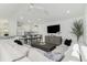 Open concept living area with a breakfast bar, spacious seating, and tile floors at 14195 Brisk Ave, Port Charlotte, FL 33953