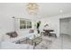 Bright living space featuring modern decor, tile flooring, and comfortable seating area at 14195 Brisk Ave, Port Charlotte, FL 33953