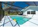 Beautiful screened-in pool with inviting lounge chairs, perfect for relaxing and enjoying the backyard view at 14195 Brisk Ave, Port Charlotte, FL 33953