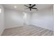 Bright bedroom features modern ceiling fan, recessed lighting, and wood-look flooring at 160 Green Pine Park, Rotonda West, FL 33947