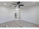 View of bright bedroom with modern ceiling fan, recessed lighting, and wood-look flooring at 160 Green Pine Park, Rotonda West, FL 33947