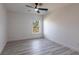 Bright bedroom features modern ceiling fan, recessed lighting, and wood-look flooring at 160 Green Pine Park, Rotonda West, FL 33947