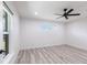 Bright bedroom features modern ceiling fan, recessed lighting, and wood-look flooring at 160 Green Pine Park, Rotonda West, FL 33947