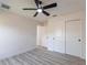 Bright bedroom features modern ceiling fan, recessed lighting, and wood-look flooring at 160 Green Pine Park, Rotonda West, FL 33947