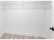 Walk-in closet with wire shelving and modern base trim at 160 Green Pine Park, Rotonda West, FL 33947