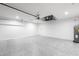 Spacious garage with epoxy flooring and ample overhead lighting at 160 Green Pine Park, Rotonda West, FL 33947