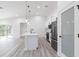 Open kitchen featuring an island with a breakfast bar, stainless steel appliances, and seamless flow to the living area at 160 Green Pine Park, Rotonda West, FL 33947
