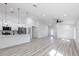 A modern kitchen with a center island, stainless steel appliances, pendant lighting and an open floor plan at 160 Green Pine Park, Rotonda West, FL 33947
