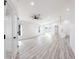 Bright and airy living room featuring neutral paint, light laminate flooring, and recessed lighting at 160 Green Pine Park, Rotonda West, FL 33947