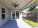 Screened-in patio with view of backyard greenery and house exterior at 160 Green Pine Park, Rotonda West, FL 33947