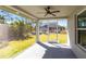 View from screened patio to backyard with lush greenery at 160 Green Pine Park, Rotonda West, FL 33947