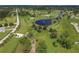 Aerial view of a community offering park, playground and green spaces at 16271 Branco Dr, Punta Gorda, FL 33955