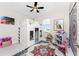 Playful ' room with custom-built house bed, colorful rug, and natural light from the window at 16271 Branco Dr, Punta Gorda, FL 33955