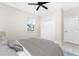 Bedroom featuring neutral walls, a comfy bed, and a bright window overlooking the yard at 16271 Branco Dr, Punta Gorda, FL 33955