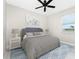 Comfortable bedroom with neutral tones, a plush bed, and a view from the window at 16271 Branco Dr, Punta Gorda, FL 33955