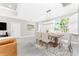 Spacious dining room with natural light and an overhead light fixture at 16271 Branco Dr, Punta Gorda, FL 33955