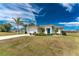 Charming single-story home with a well-manicured lawn and inviting entrance at 16271 Branco Dr, Punta Gorda, FL 33955