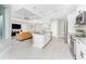 Open concept kitchen with an island, stainless appliances, and an open living area at 16271 Branco Dr, Punta Gorda, FL 33955